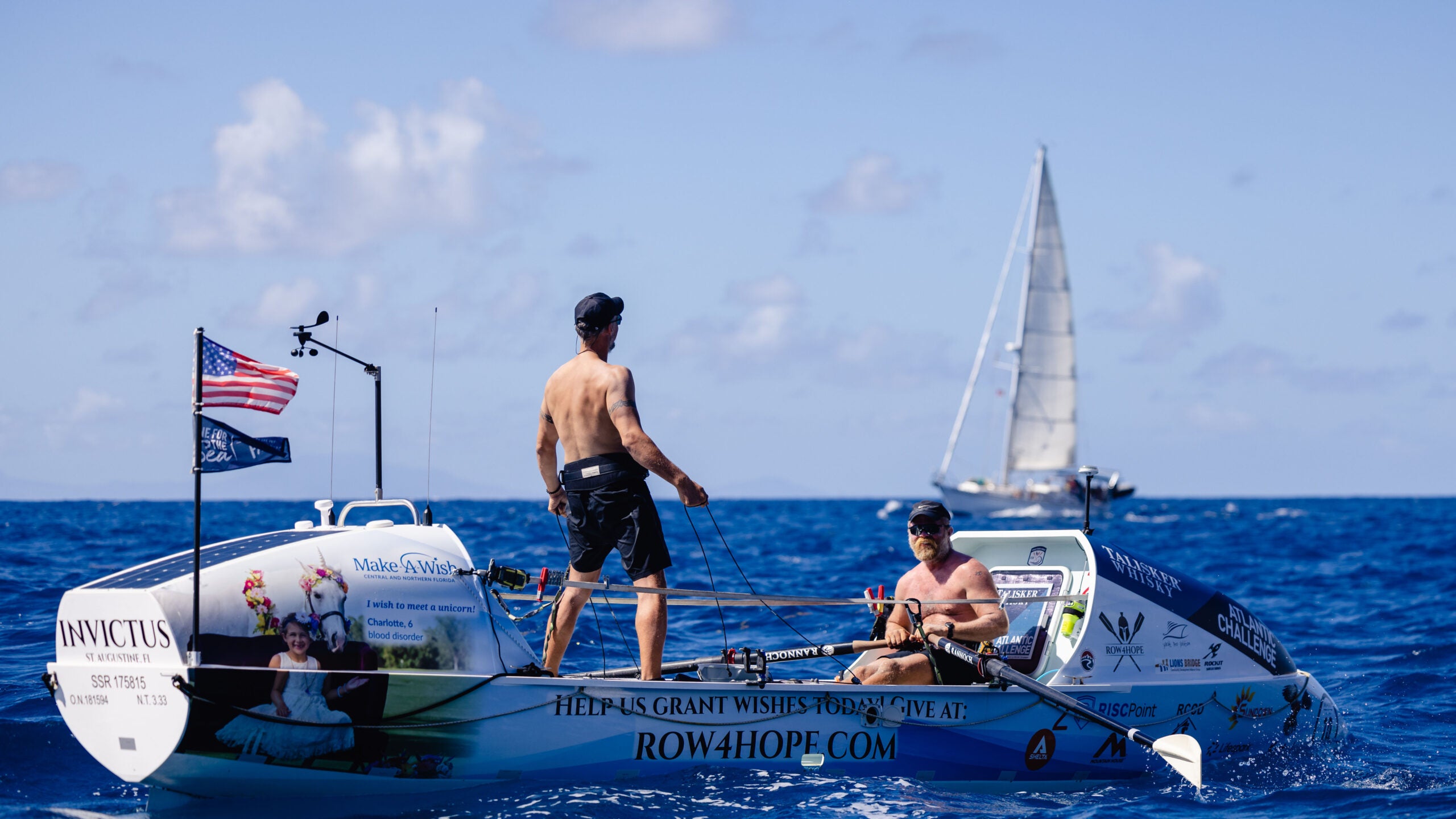 Photo of Sport fishing boat cruises across the ocean, leaving a