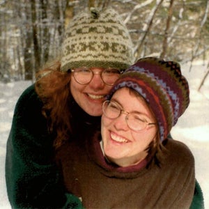 Two women embracing outside