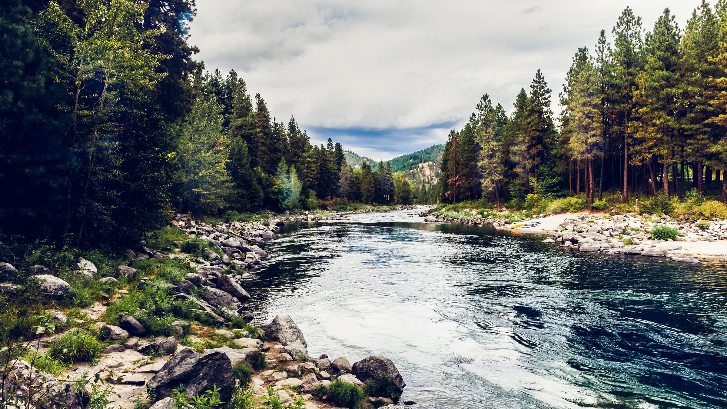 A scenic and tree lined landscape of Wenatchee River taken near Leavensworth