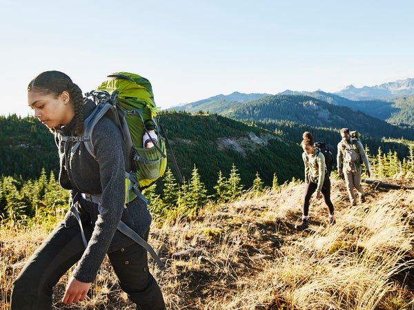 Woman hiking with her family.
