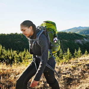 Woman hiking with her family.