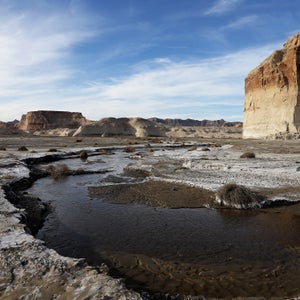 Water trickles through an area of Lake Powell that used to be underwater.