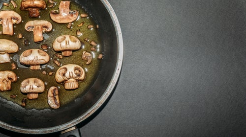 Mushrooms cooking in a pan
