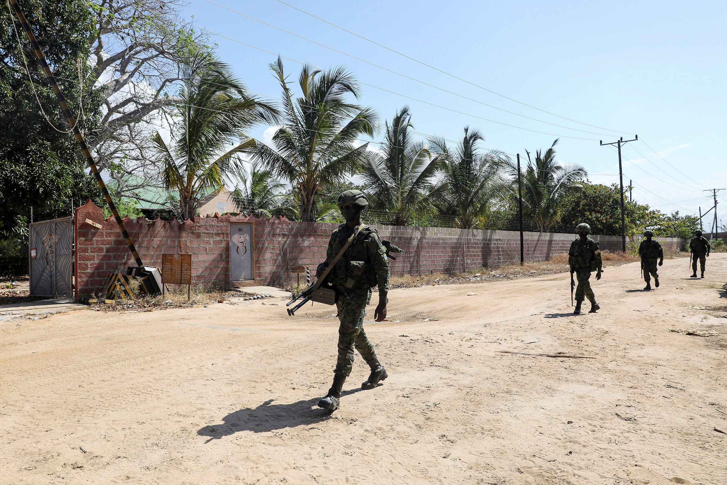 A peacekeeping force from Rwanda patrols outside the Amarula gates.