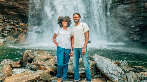 Ron Griswell and Linea Johnson, of HBCUs ԹϺ—an organization started by Griswell to provide more outdoor opportunities for HBCU students—exploring Looking Glass Falls in Pisgah National Forest