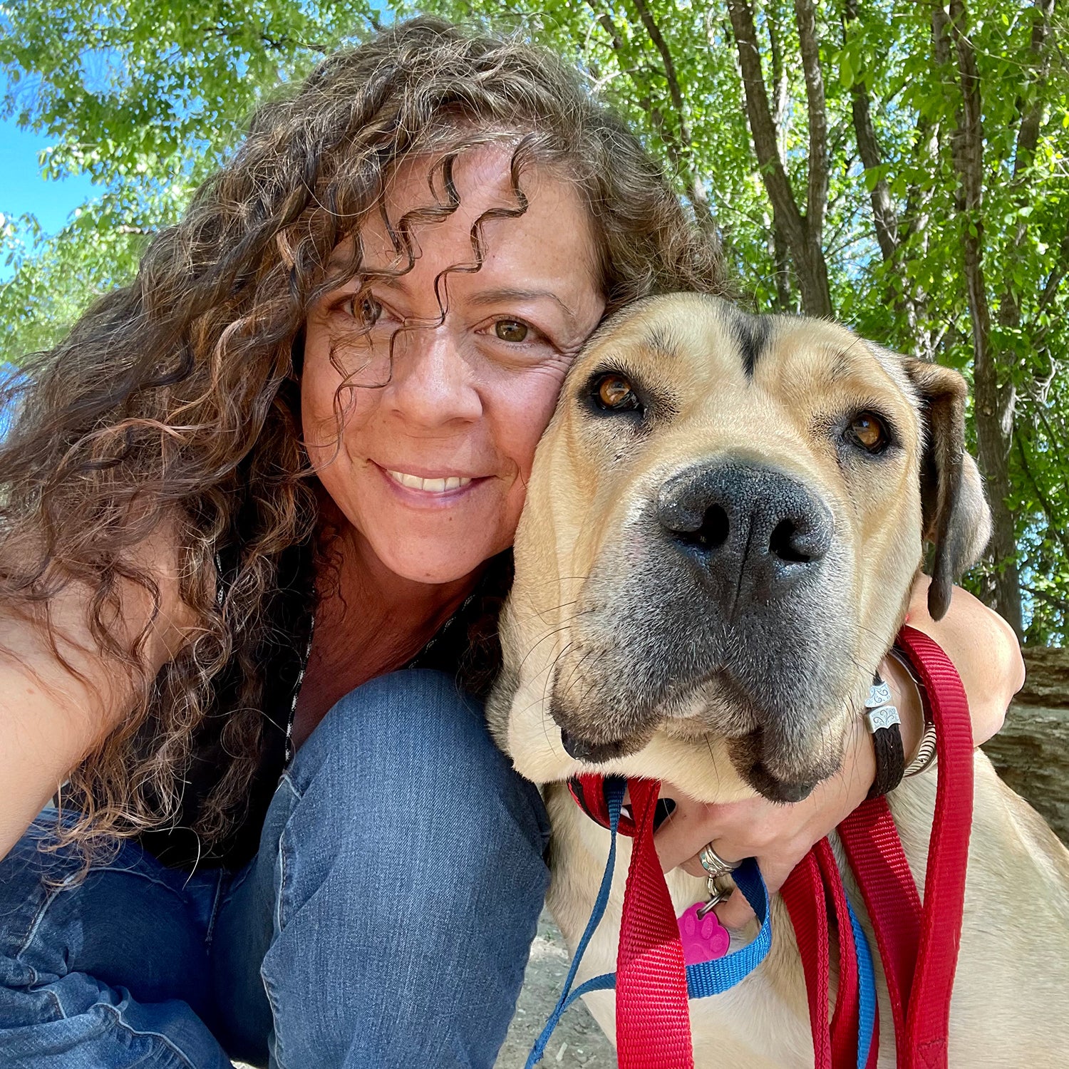 Mattie Allen with Porky, a mother of seven who survived the Camp Canyon–Hermit’s Peak fire