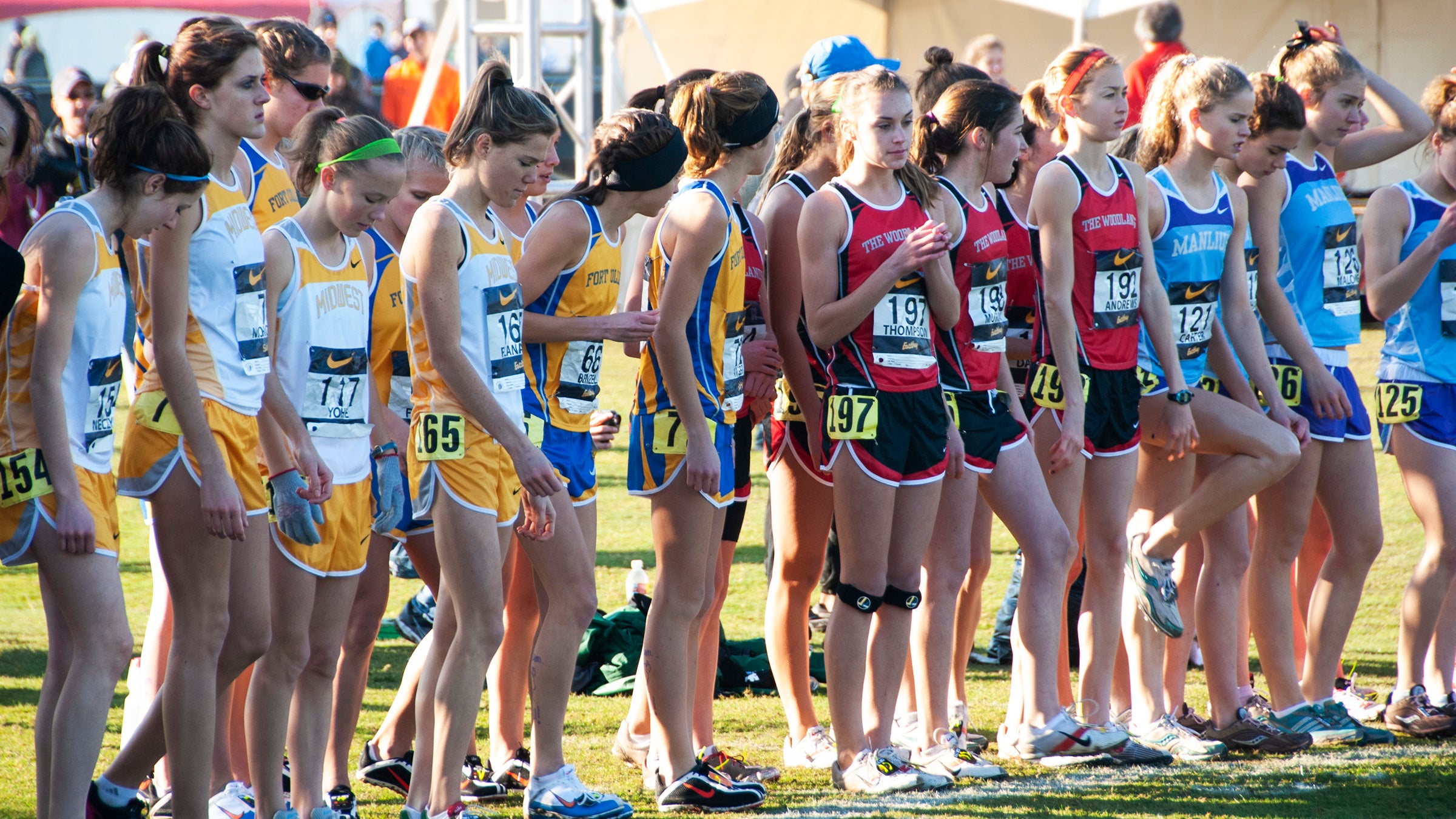women cross country runners on start line looking nervous