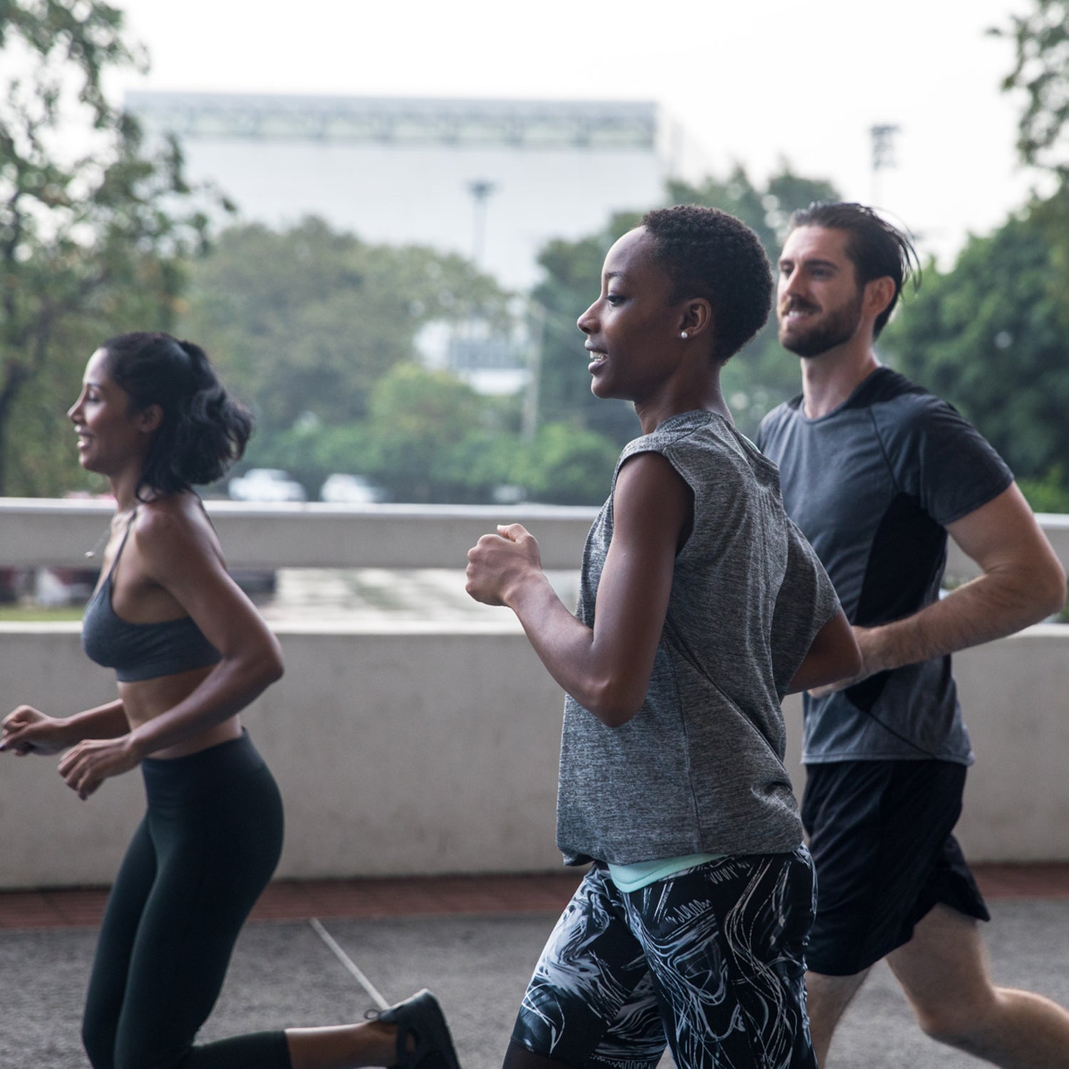 Jogging couple. African american persons man and woman running