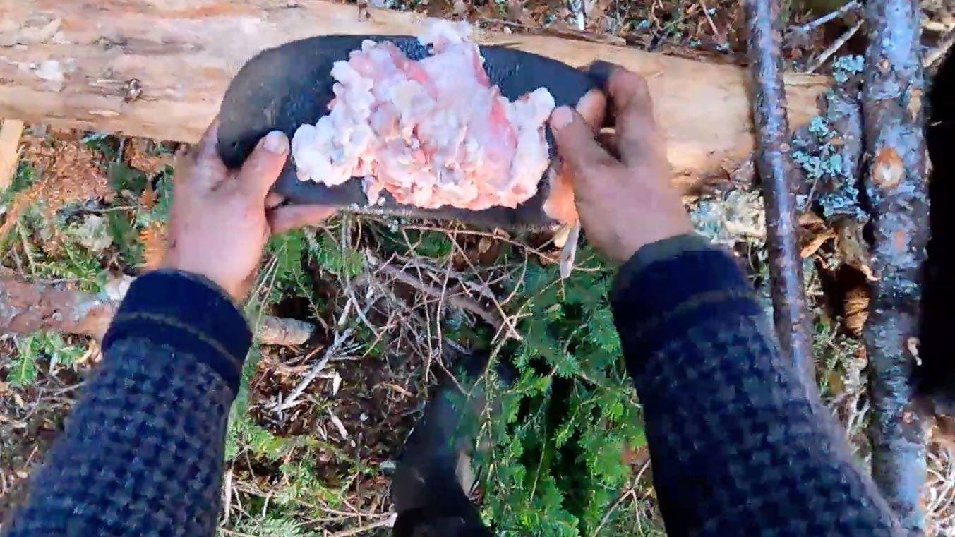 Benji Hill and his rendered beaver fat. 