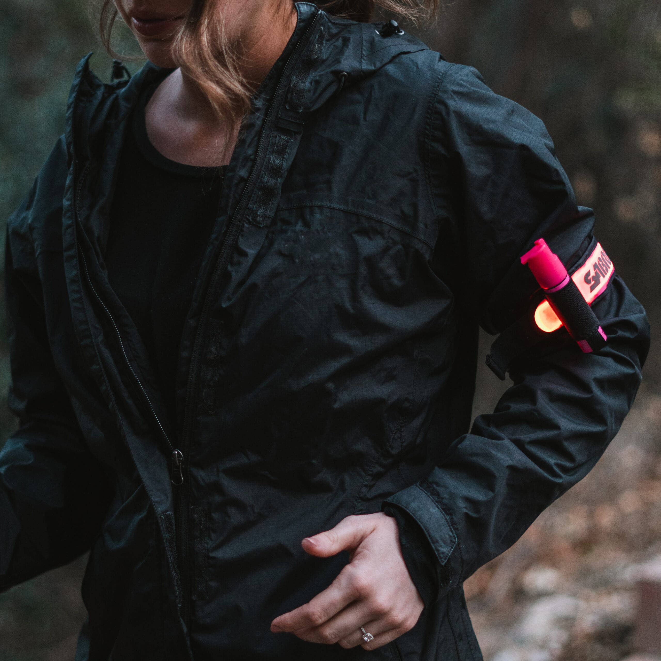 A reflective arm band, like this one from Sabre, helps boost nighttime visibility (and doubles as a pepper spray holster).