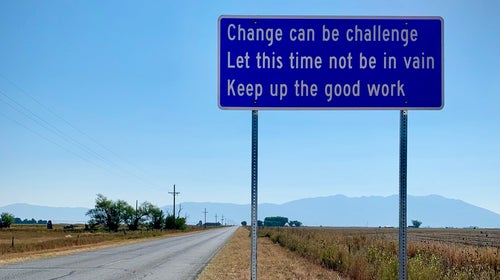 A sign next to a road