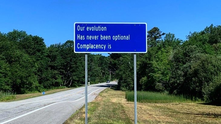 A sign next to a road