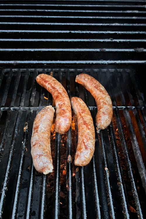 Merguez sausages on Ogbonna鈥檚 grill