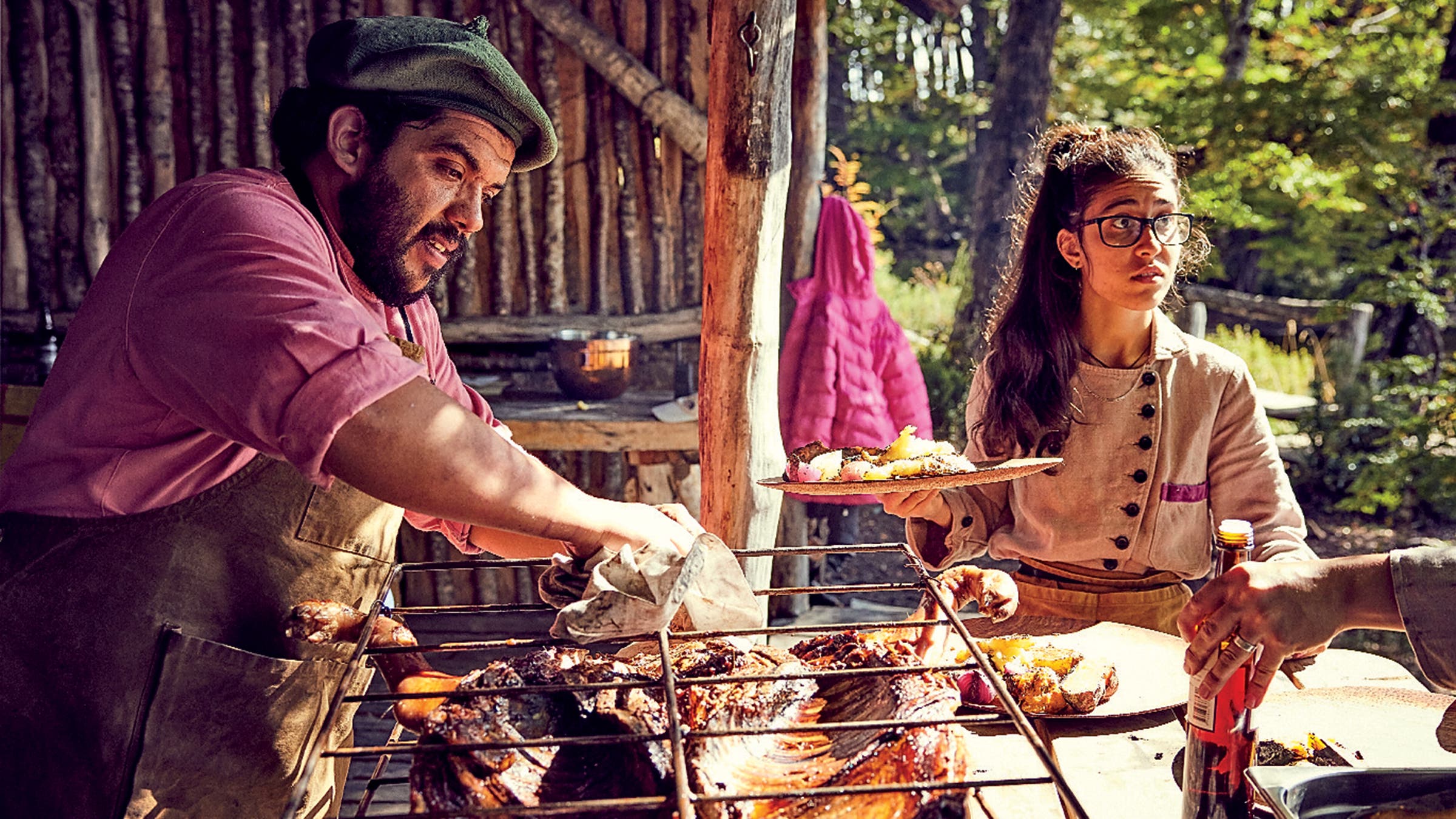 Mallman’s staff roasts a whole pig over the fire for lunch.