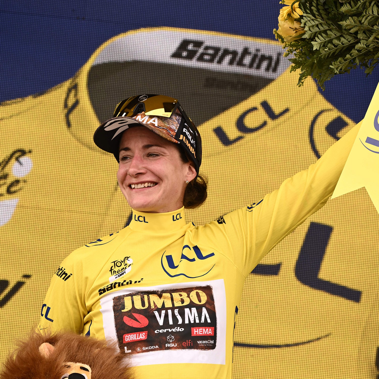 Team Jumbo Visma's Dutch rider Marianne Vos celebrates her overall leader yellow jersey on the podium at the end of the 2nd stage of the new edition of the Women's Tour de France cycling race