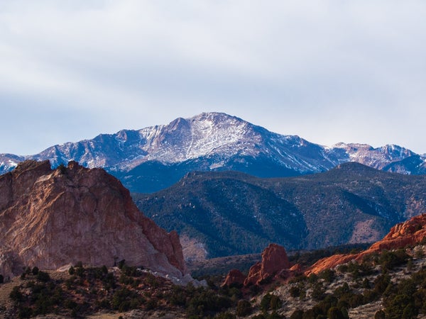 A view of snow-capped Pikes Peak in the daytime.