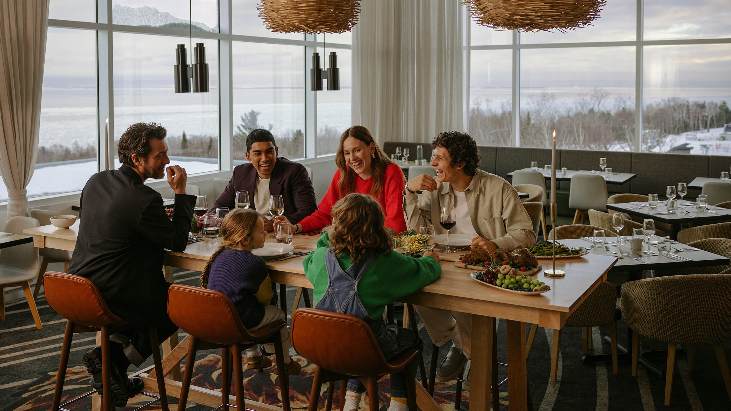 A group of people enjoying a meal at the dinner table.