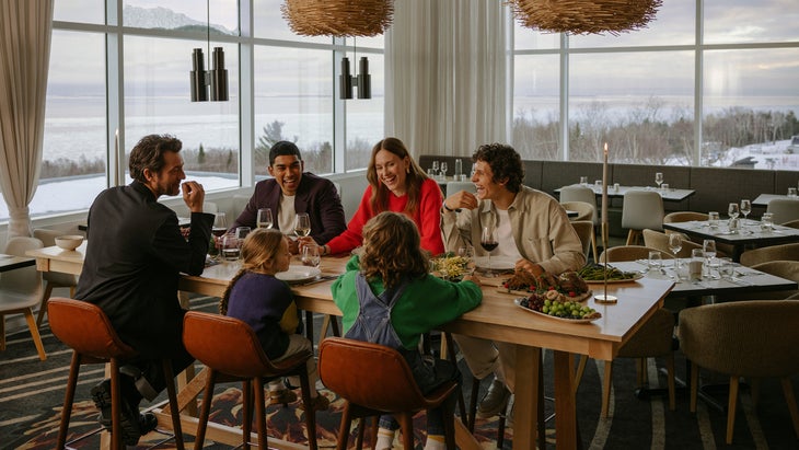 A group of people enjoying a meal at the dinner table.