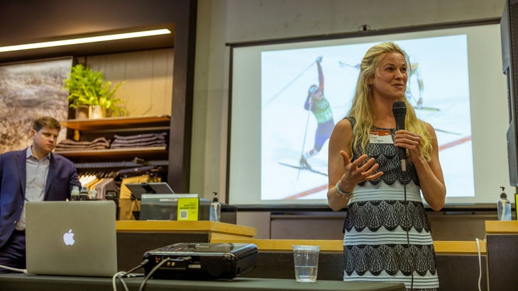 Woman holding a microphone giving presentation