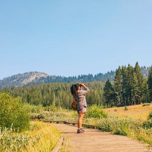 Hiker gazing up at the sky from a trail in Reno