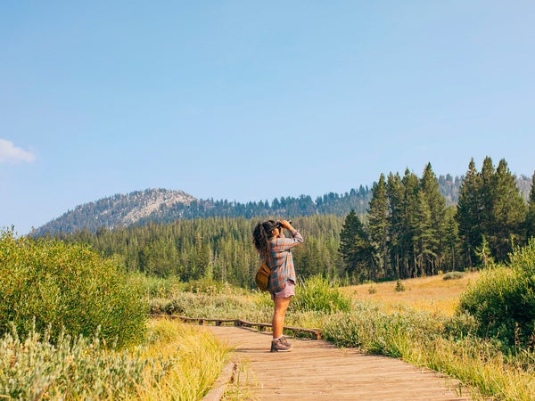 Hiker gazing up at the sky from a trail in Reno