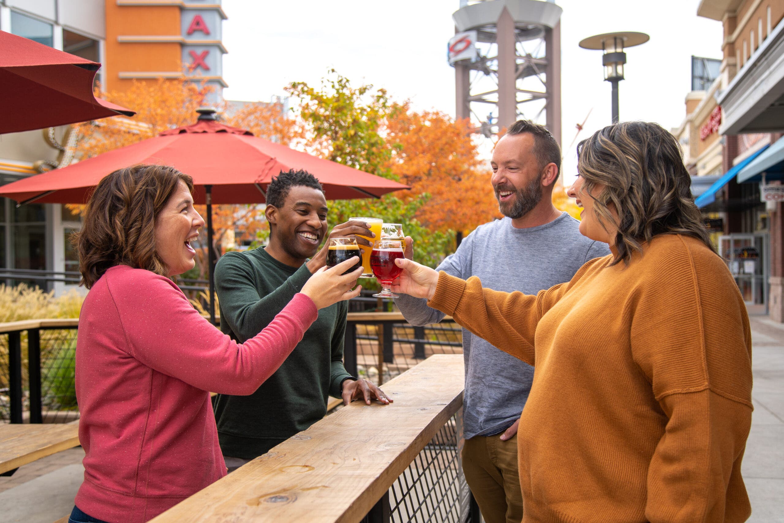 Four adults drinking beer at a Reno Brewery
