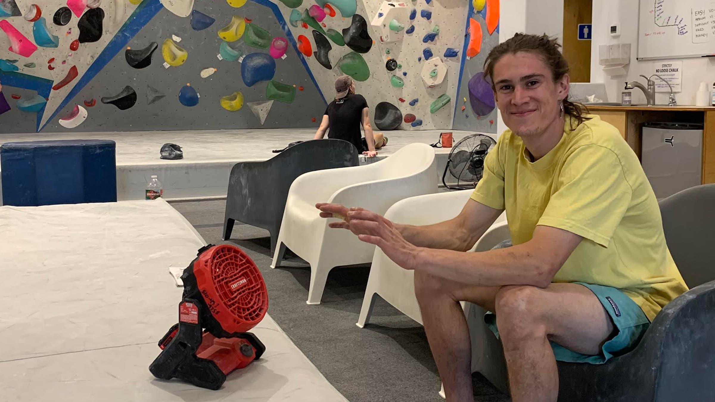 climber in gym with fan