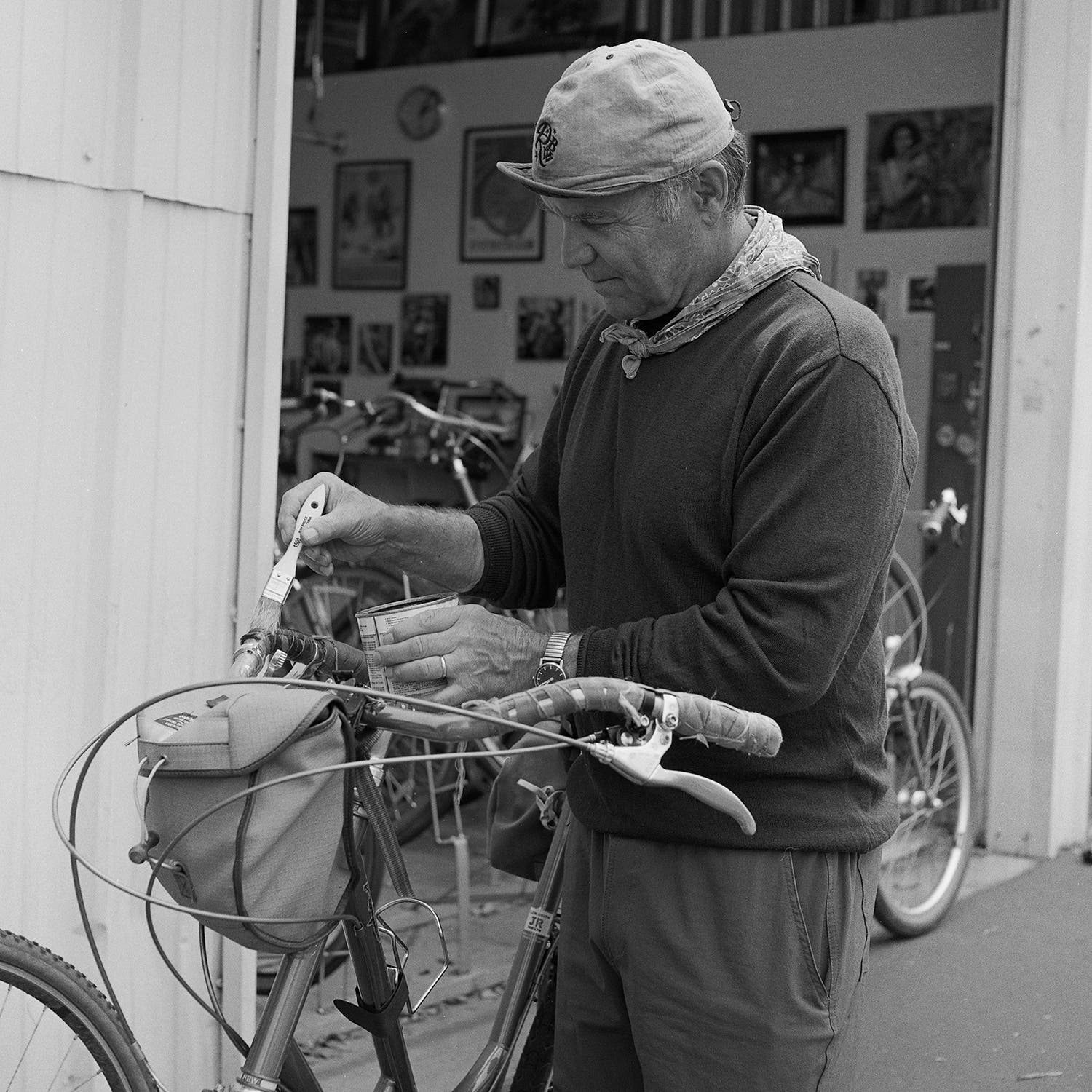 Grant Petersen, founder of Rivendell Bicycle Works, shellacs a handlebar wrap.
