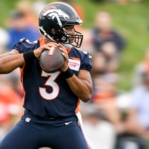 Russell Wilson, Denver Broncos Quarterback, practicing