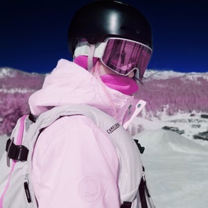 professional snowboarder wearing a helmet and goggles
