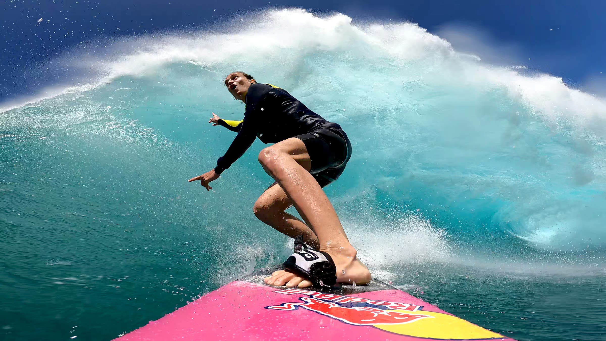 Woman surfing a wave