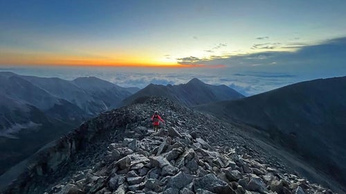 A hiker on a tall Colorado mountain