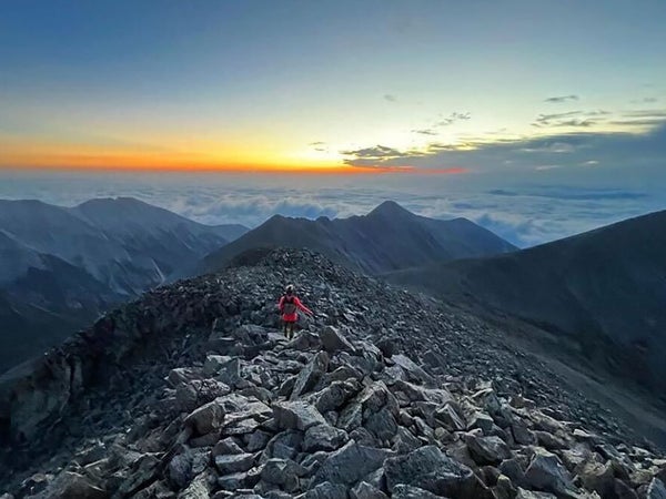 A hiker on a tall Colorado mountain