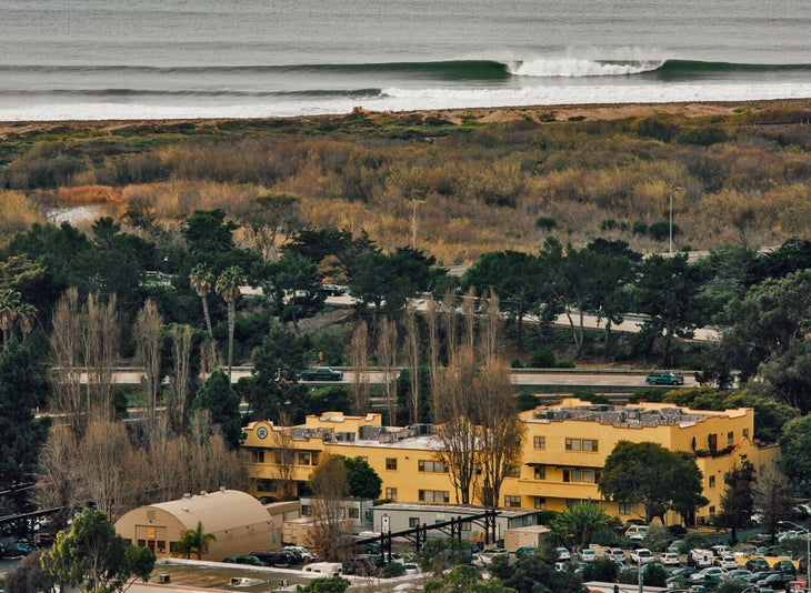 Yellow office building next to the ocean