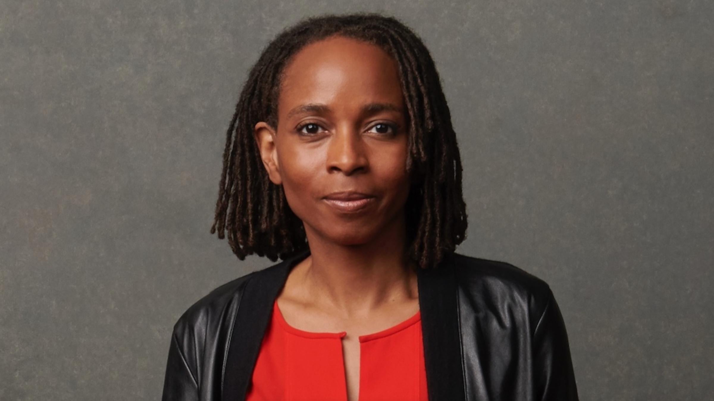 Headshot of woman in red shirt