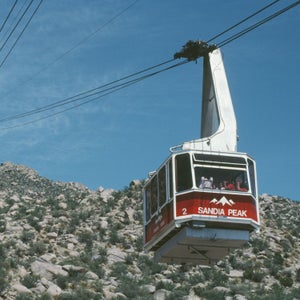 Tram ascending rocky mountainside