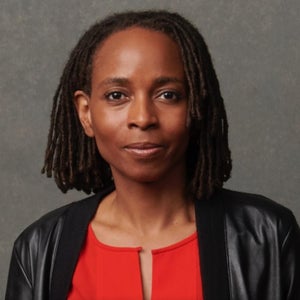 Headshot of woman in red shirt