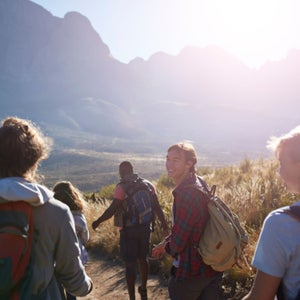 Friends trekking in the mountains and laughing