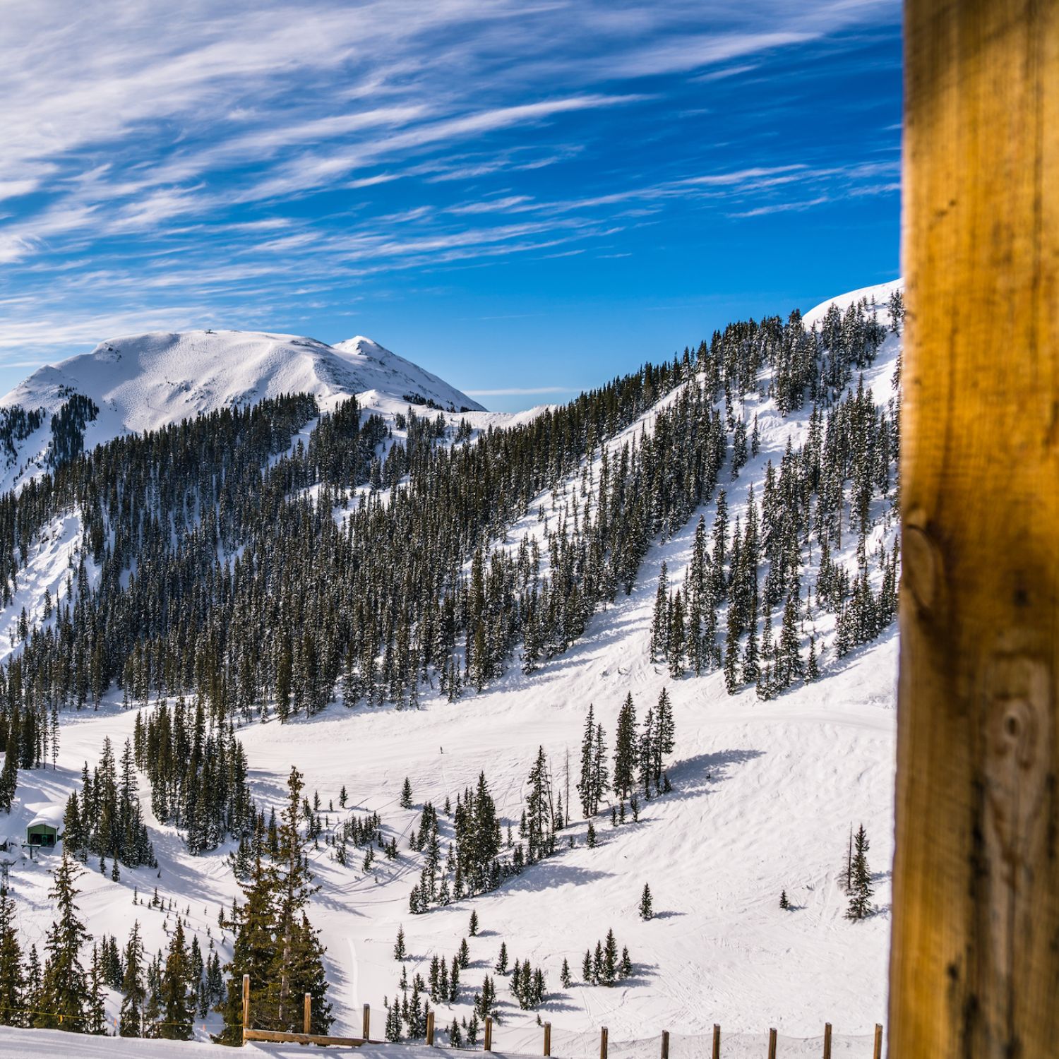 Snowy ski resort under a blue sky