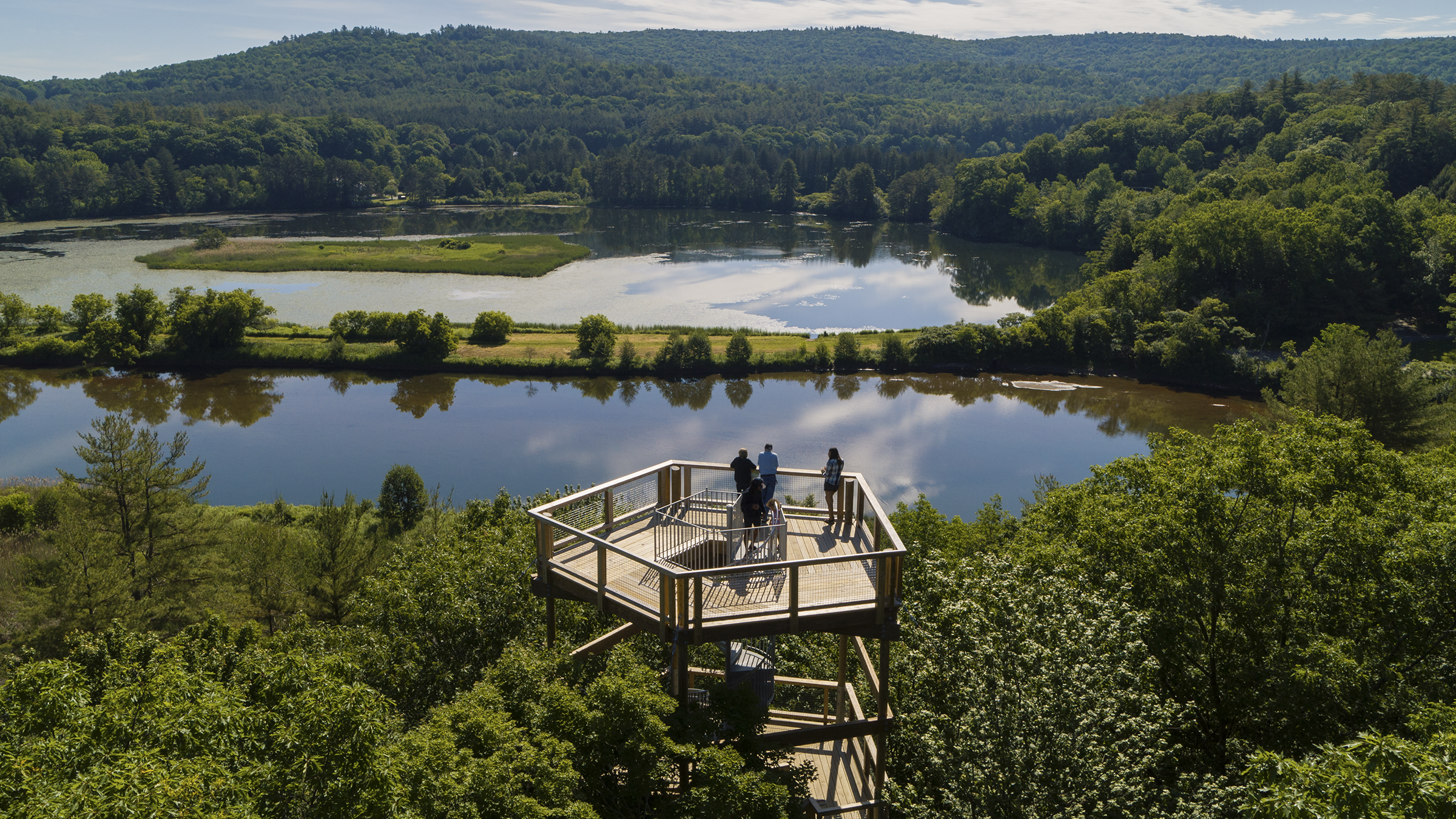 people overlooking a lake in vermont
