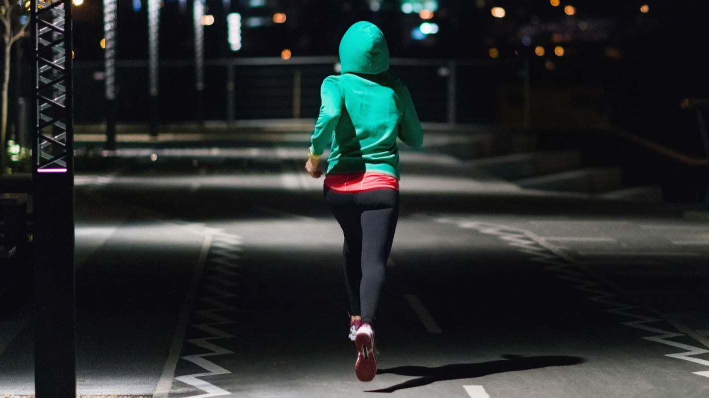 Woman running at night