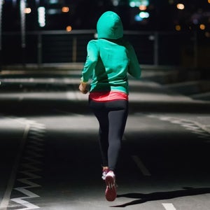 Woman running at night