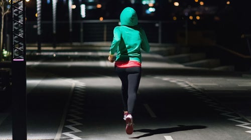 Woman running at night