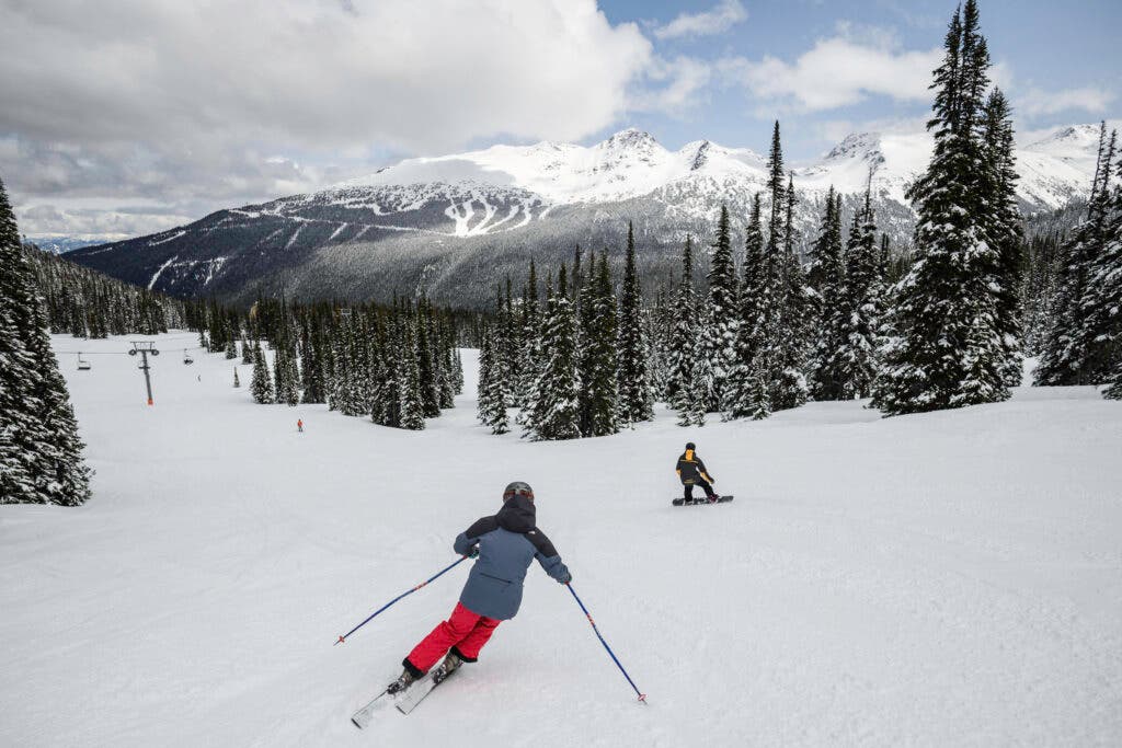 Family skiing with a Mountain Host in Whistler Blackcomb.