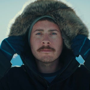 man with hood on in the winter