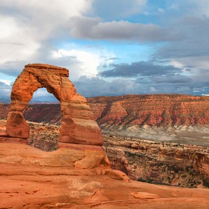 An arch-shaped red rock formation