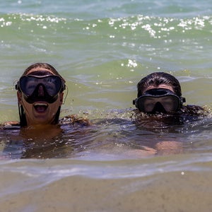 two women swimming in the ocean