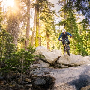 A mountain biker descends a rocky trail
