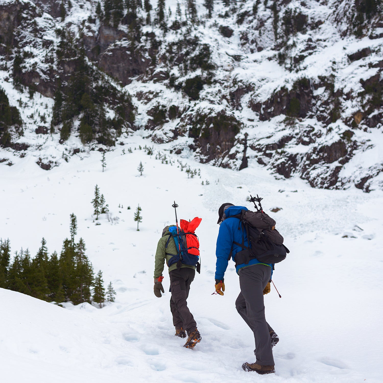 Two hikers walking through the snow