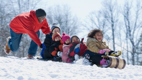 Kids sledding in kids winter gear